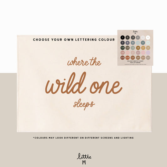 Where the wild one sleeps hand lettered script banner 50x70cm - choose your own lettering colour